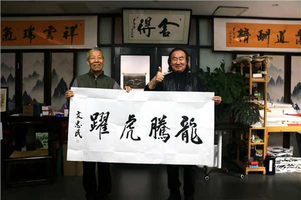 “精忠报国武术文化行”走进少林小龙武校 共赏功夫盛宴，开展书法交流